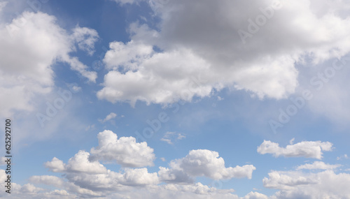 Fototapeta Naklejka Na Ścianę i Meble -  Bright white clouds over blue sky