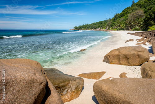 Big granite rocks on the Grand Anse beach. La Digue island, Seychelles. Tropical landscape with sunny sky. © Alexey Oblov