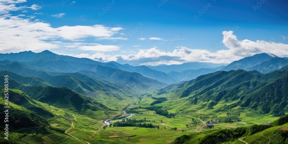 a valley with mountains in the background