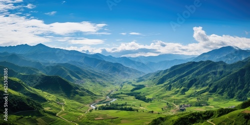 a valley with mountains in the background