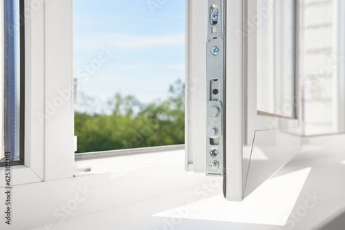 PVC window frame open closeup view. Bottom window frame detail. Room open window ventilation.
