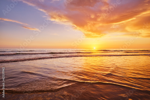 Atlantic ocean sunset with surging waves at Fonte da Telha beach  Costa da Caparica  Portugal