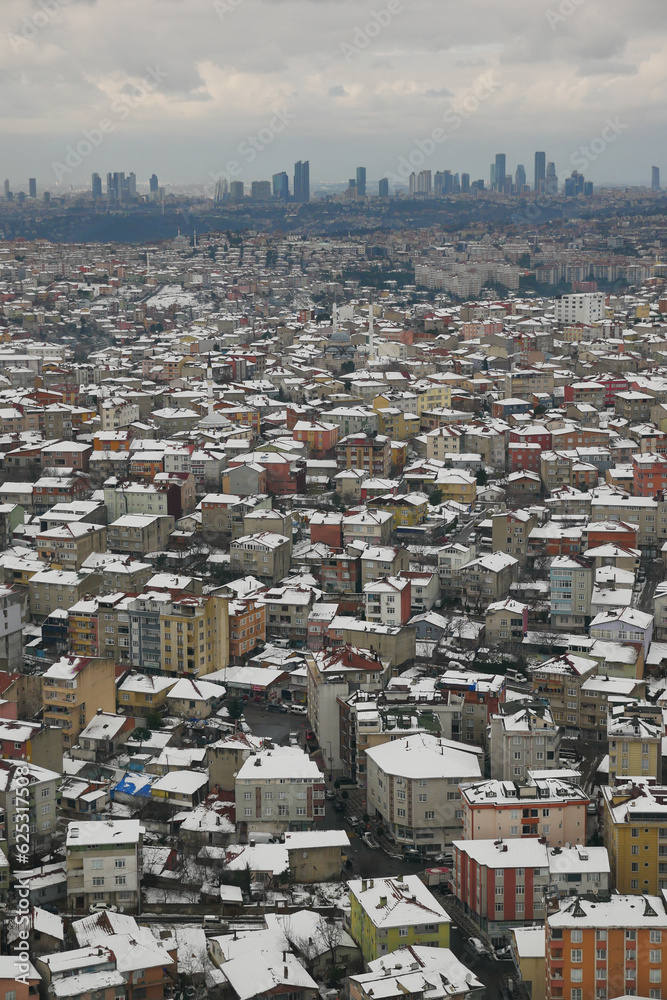 Fototapeta premium top view of Snowfall on buildings in istanbul city 