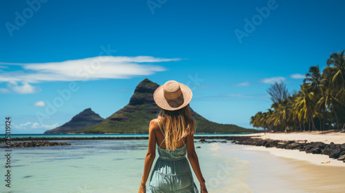 A young girl standing in shallow water on La Digue island, Seychelles Generative AI © Nataliia