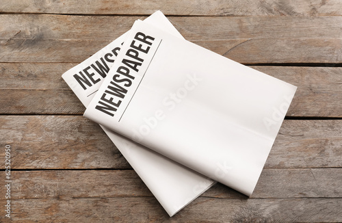 Принти на полотні Blank newspapers on wooden background