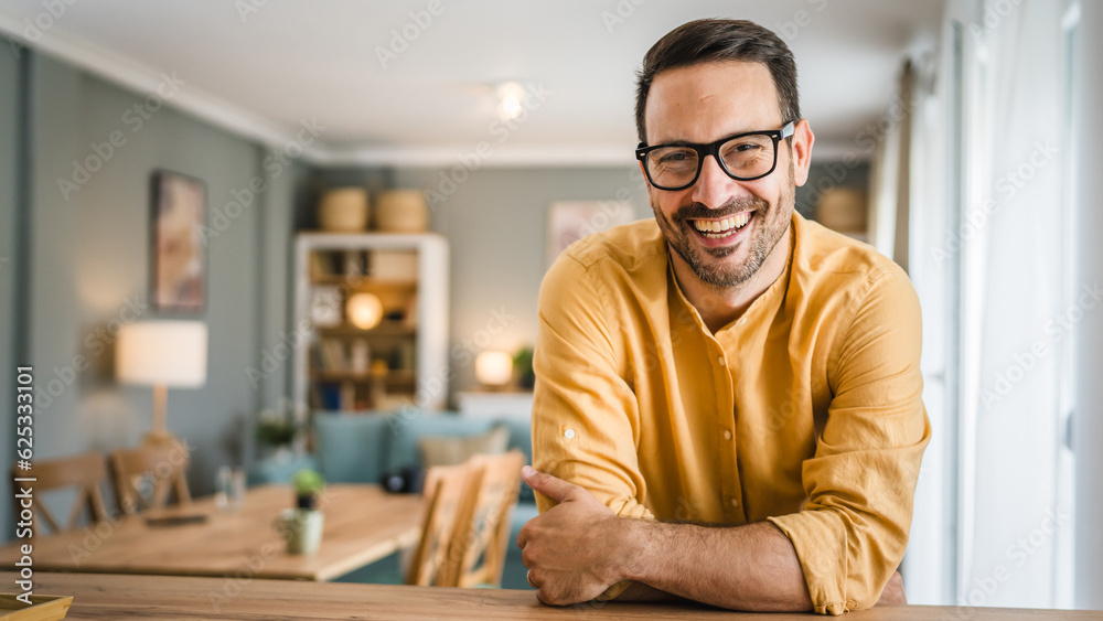 One adult man with eyeglasses stand at home happy smile One adult man with eyeglasses stand at home happy smile