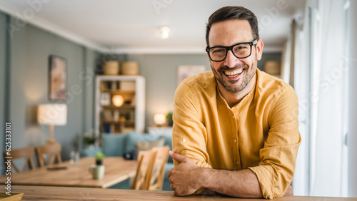 One adult man with eyeglasses stand at home happy smile © Miljan Živković