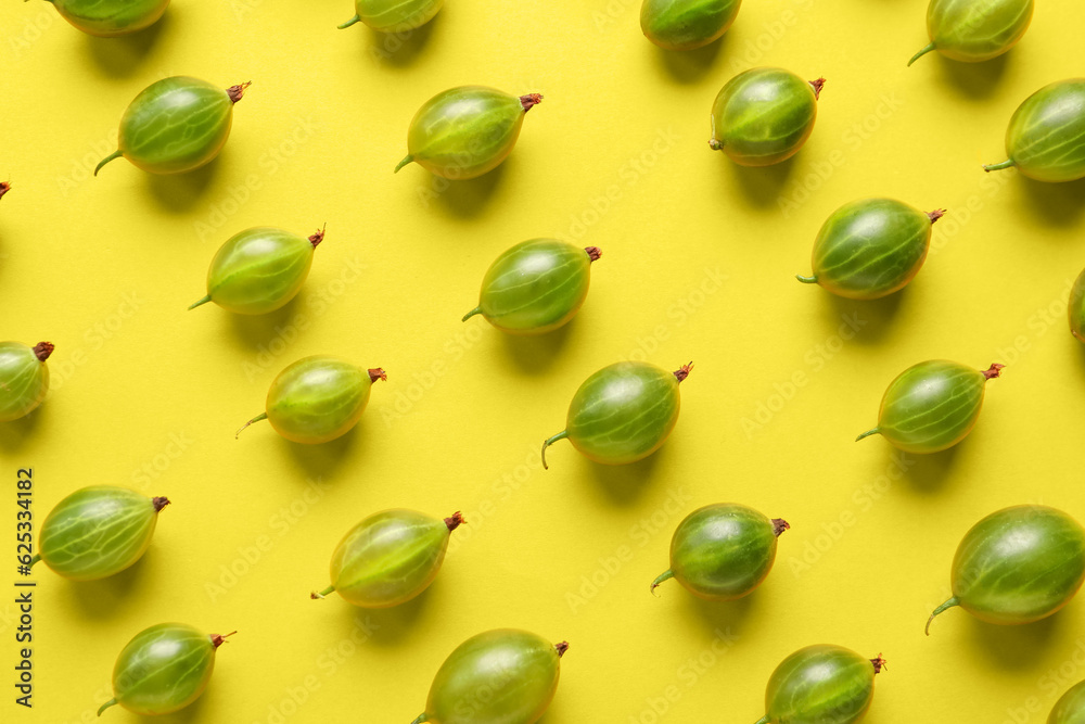 Many fresh gooseberries on yellow background Many fresh gooseberries on yellow background