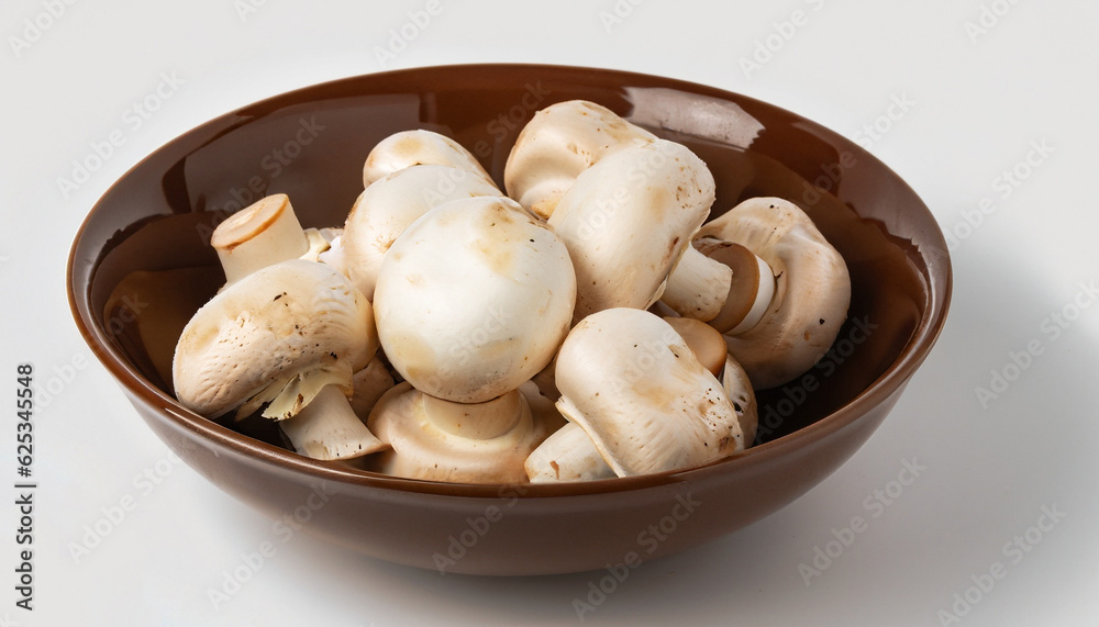 Fresh white mushrooms champignon in brown bowl on white background. Fresh white mushrooms champignon in brown bowl on white background.