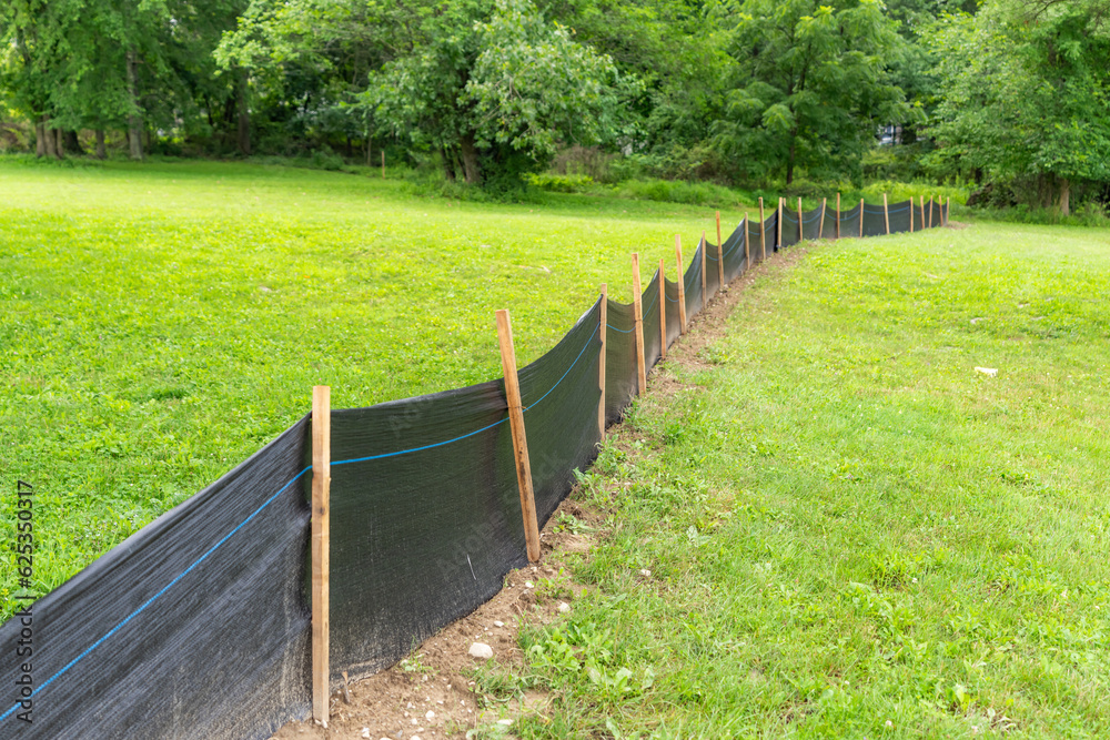 Silt Fence fabric with wooden posts installed prior to the start of construction.
