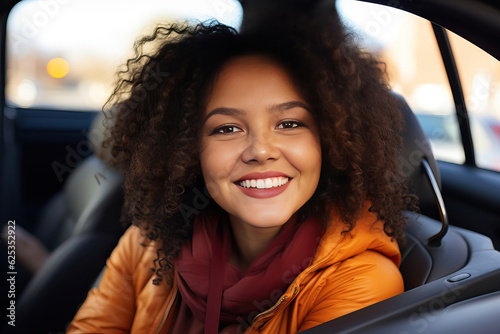 happy young woman in a car,...