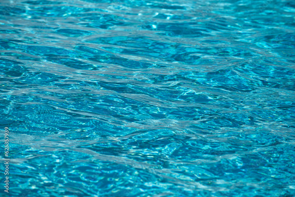 Pool water background, blue wave abstract or rippled water texture background.