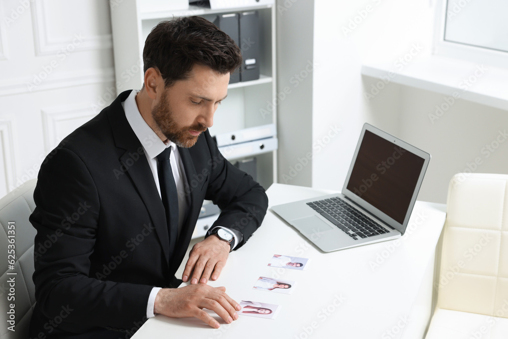 Human resources manager choosing employee among different applicants in office