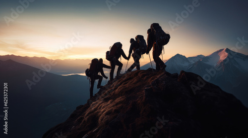 Mountains team climbers on snowy trail  conquered the mountain in winter  Climber on top of a winter view of snow-capped mountain peaks sunshine