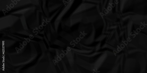 Black fabric background. Black crumpled and wrinkled paper texture crush paper so that it becomes creased and wrinkled. Old black crumpled paper sheet background texture. 
