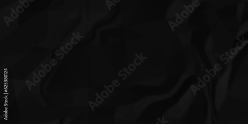 Black crumpled and wrinkled paper texture crush paper so that it becomes creased and wrinkled. Old black crumpled paper sheet background texture. 