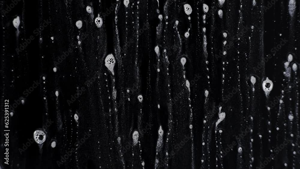 Soap water on a wet surfeac with a black background