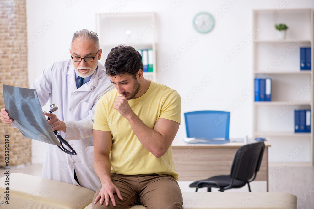 Young male patient visiting old male doctor radiologist