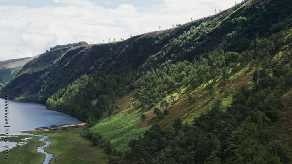 Aerial Shot Flying Toward Mountains in Wicklow Mountains National Park in Ireland. 4K Drone Aerial Shot Flying Toward Mountains in Wicklow Mountains National Park in Ireland. 4K Drone