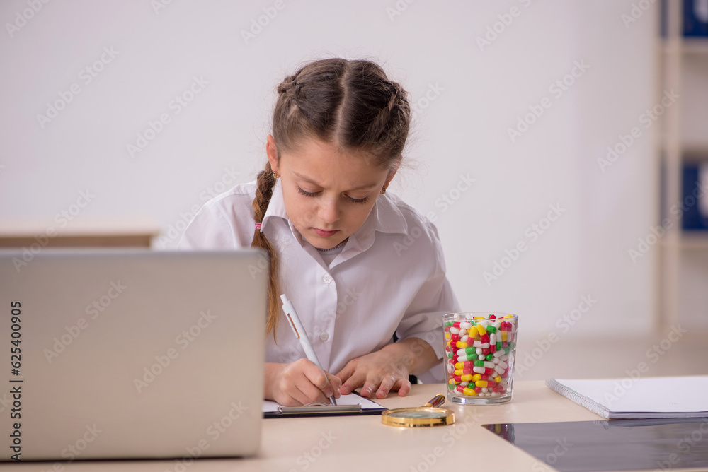 Small girl playing doctor in the clinic Small girl playing doctor in the clinic