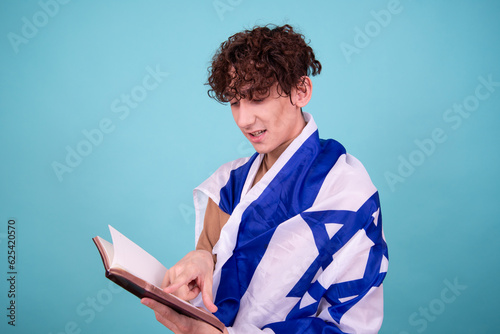 Religion and cultural heritage. A young attractive guy with a Jewish flag. photo