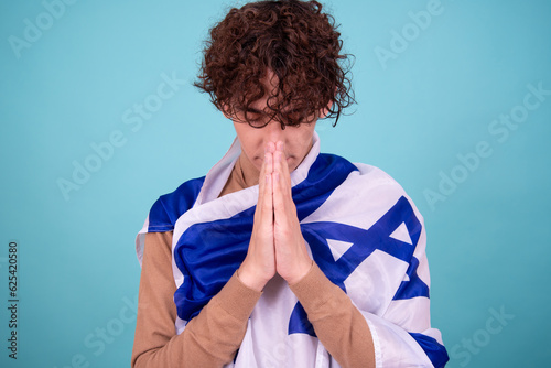 Religion and cultural heritage. A young attractive guy with a Jewish flag. photo