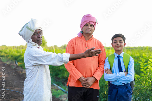 Indian three people standing in farm