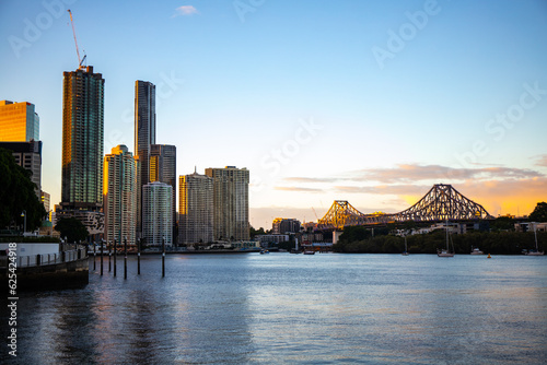 panorama of brisbane cbd on sunset; skyscrapers and famous story bridge in downtown of brisbane city in queensland, australia	