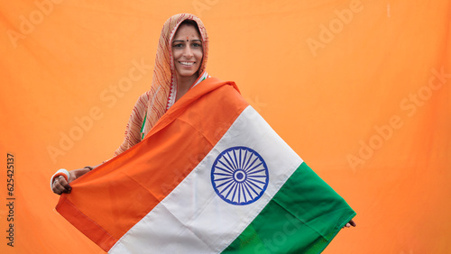 Indian woman holding tricolour indian flag on occasion of Independence Day India