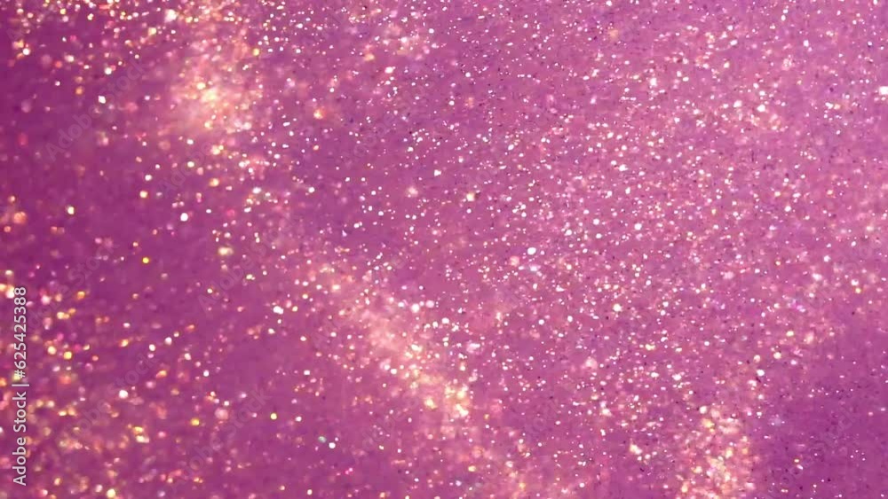 Golden Dust Particles Motion In Violet Fluid. Gold particles moving background. Abstract backdrop of natural glitter sparkling sequins floating in liquid.