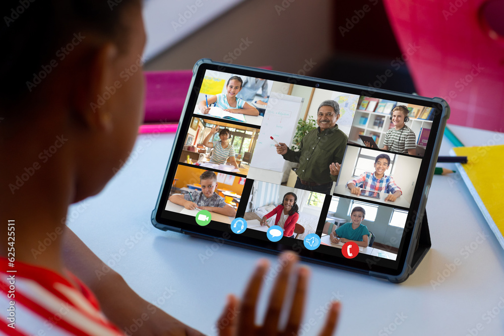 African american boy attending online class with teacher and students over digital tablet screen African american boy attending online class with teacher and students over digital tablet screen