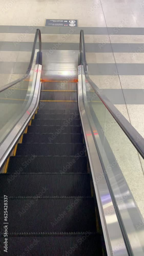 Modern steps of the escalator is going down, Department store. Modern steps of the escalator is going down, Department store.
