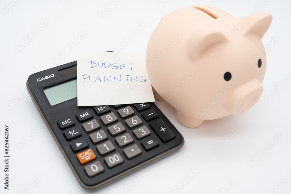 Piggy bank with Calculator on isolated background. Saving money and financial management. Piggy bank with Calculator on isolated background. Saving money and financial management.