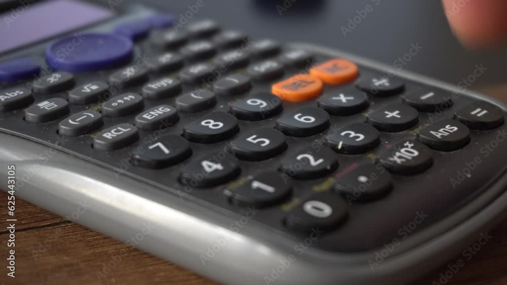 Calculating Taxes With Money And Calculator Calculating Taxes With Money And Calculator