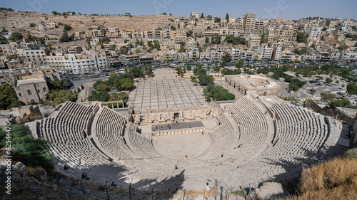 city scape of amman jordan with historic theater in front