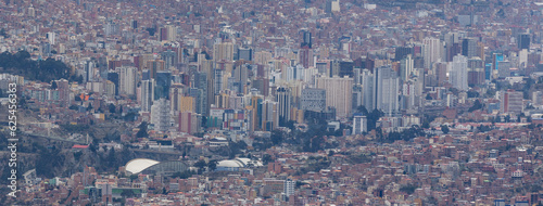 View from the scenic road to the landmark Muela del Diablo over the highest administrative capital, the city La Paz and El Alto in Bolivia - close up of hundreds of houses and skyscrapers - Panorama