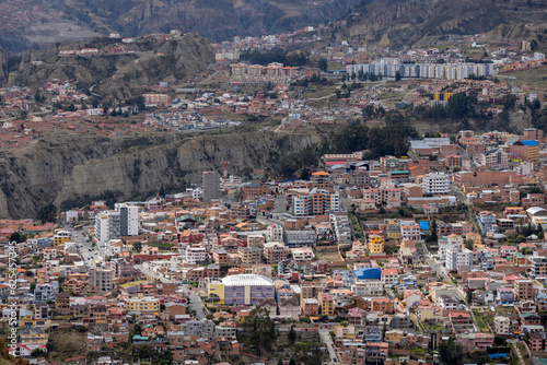 View from the scenic road to the landmark Muela del Diablo over the highest administrative capital, the city La Paz and El Alto in Bolivia - close up of hundreds of houses © freedom_wanted
