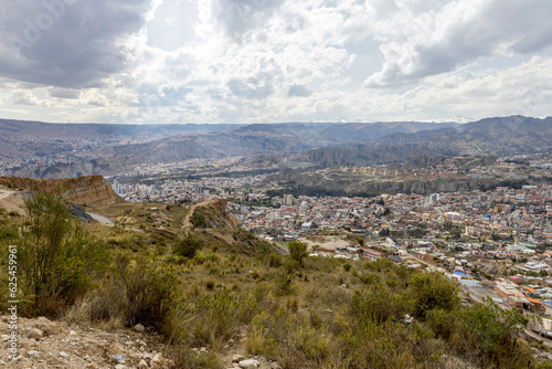 View from the scenic road to the landmark Muela del Diablo over the highest administrative capital, the city La Paz and El Alto in Bolivia