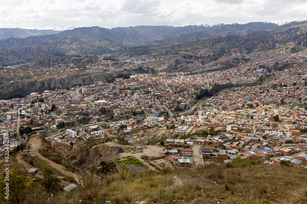 View from the scenic road to the landmark Muela del Diablo over the highest administrative capital, the city La Paz and El Alto in Bolivia View from the scenic road to the landmark Muela del Diablo over the highest administrative capital, the city La Paz and El Alto in Bolivia