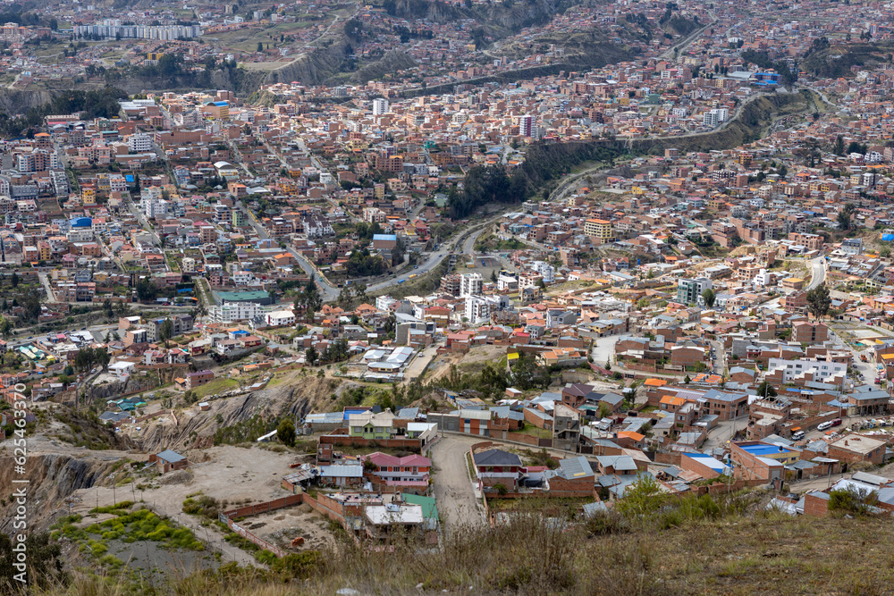 View from the scenic road to the landmark Muela del Diablo over the highest administrative capital, the city La Paz and El Alto in Bolivia - close up of hundreds of houses of La Paz