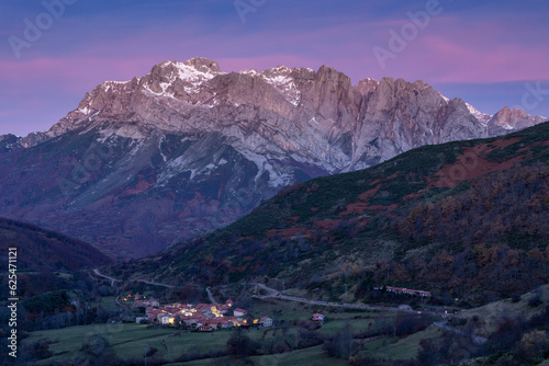Western massif of the Picos de Europa National park and the village of Santa Marina placed in the Valdeon valley at night, Leon, Spain.