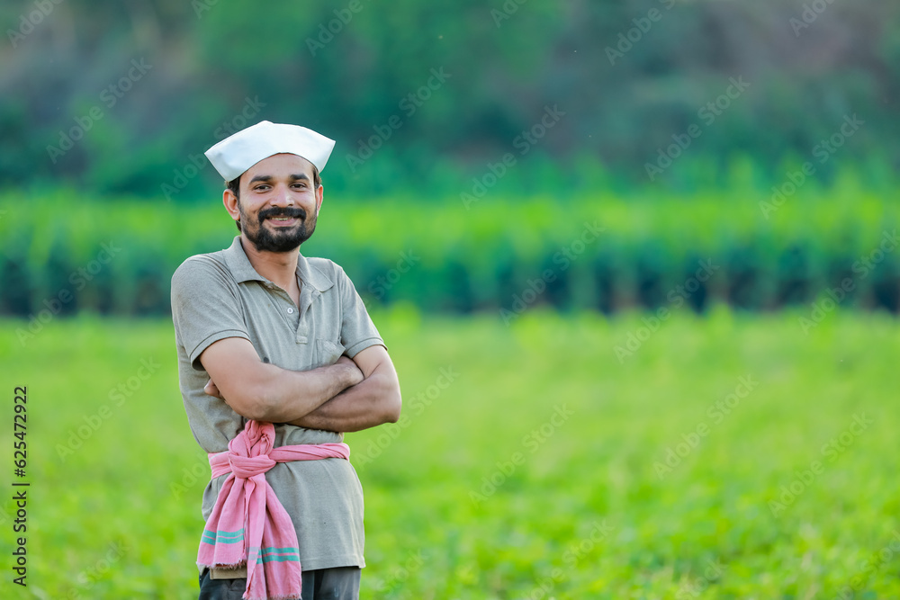 Maharashtra look farmer, happy farmer standing in Cwopea farm Maharashtra look farmer, happy farmer standing in Cwopea farm