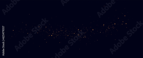 Golden sequins glow with many lights. Glittering dust. Luxurious background of golden particles.