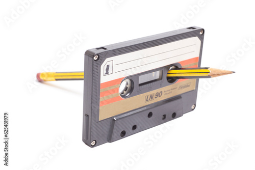 Audio cassette tape with pencil side 1 isolated on white background, vintage 80's music concept