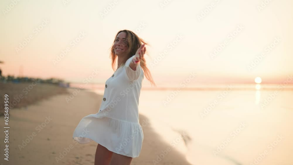 Joyful happy carefree woman running turning jumping on ocean sandy beach on summer vacation. Satisfied relaxed blonde female resting on luxury resort feeling freedom happiness. Travel tourism concept. Joyful happy carefree woman running turning jumping on ocean sandy beach on summer vacation. Satisfied relaxed blonde female resting on luxury resort feeling freedom happiness. Travel tourism concept.