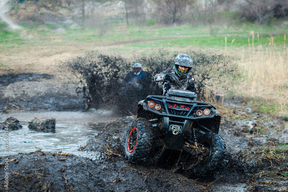 ATV, UTV, buggy, 4x4 off-road vehicle in muddy water. Extreme, adrenalin ATV, UTV, buggy, 4x4 off-road vehicle in muddy water. Extreme, adrenalin