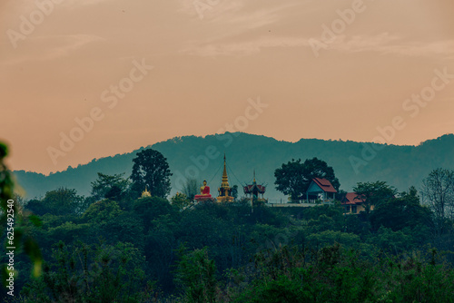 The view of the natural background of the mountain close-up, with blurred fog scattered in the rainy season or the humid climate, with beautiful green trees in the ecological system photo