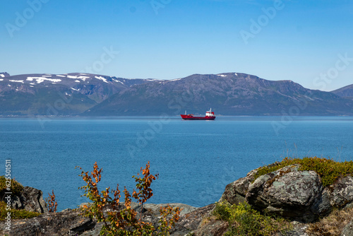 Stunning view of mountains and fords in Norway.Lattervik, red ship