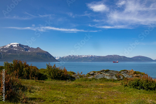 Stunning view of mountains and fords in Norway.Lattervik, red ship