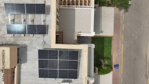 Top down aerial view of home with solar panels on the roof photo